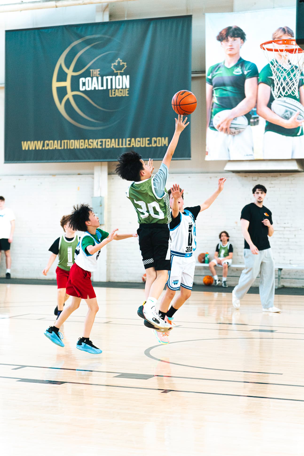 A Junior division player going up for a contested layup during a 3x3 game